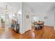 Entryway leading to dining room and staircase, featuring hardwood floors and elegant decor at 8834 Palmetto Rd, Edisto Island, SC 29438