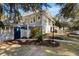 Back of the house features a deck, a fenced yard, and lush landscaping at 8834 Palmetto Rd, Edisto Island, SC 29438