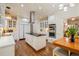 Open kitchen design featuring an island, stainless appliances, and wood floors at 8834 Palmetto Rd, Edisto Island, SC 29438