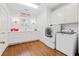 Clean, spacious laundry room with modern appliances and ample counter space at 8834 Palmetto Rd, Edisto Island, SC 29438
