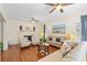 Charming living room with fireplace, hardwood floors, and coastal-themed decor at 8834 Palmetto Rd, Edisto Island, SC 29438