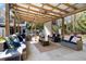 Spacious covered patio with comfortable seating, perfect for outdoor gatherings and relaxation at 8834 Palmetto Rd, Edisto Island, SC 29438