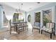 Bright sun room with travertine floors, seating, and abundant natural light at 8834 Palmetto Rd, Edisto Island, SC 29438