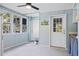 Bright sunroom with plenty of windows and easy access to the outdoors at 8834 Palmetto Rd, Edisto Island, SC 29438