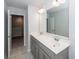 Bright bathroom with a double sink vanity, large mirror, and modern fixtures at 9620 Corby Ct, Summerville, SC 29485