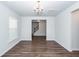 Dining room showcases wood floors and a view into the foyer and staircase at 9620 Corby Ct, Summerville, SC 29485