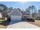 Beautiful two-story home with manicured lawn and attached two-car garage at 9620 Corby Ct, Summerville, SC 29485