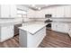 Spacious kitchen equipped with stainless steel appliances, white cabinetry, and granite countertops at 9620 Corby Ct, Summerville, SC 29485