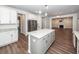 Spacious kitchen with a center island, granite countertops, stainless steel appliances, and open floor plan at 9620 Corby Ct, Summerville, SC 29485