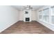 Living room with a fireplace, ceiling fan, recessed lighting, and multiple windows providing natural light at 9620 Corby Ct, Summerville, SC 29485