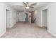 Open living room with neutral carpet and staircase at 9620 Corby Ct, Summerville, SC 29485