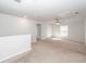 Open loft area with neutral carpet and natural light at 9620 Corby Ct, Summerville, SC 29485