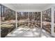 Enjoy the outdoors bug-free on this concrete screened-in porch at 9620 Corby Ct, Summerville, SC 29485