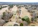 Stunning aerial view of a golf course with ponds and tree-lined fairways, creating a scenic landscape at 1006 Retreat Ave, Moncks Corner, SC 29461