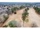 Aerial view of the lush green golf course with tree lined fairways, nestled among homes in a quiet neighborhood at 1006 Retreat Ave, Moncks Corner, SC 29461