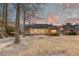 Expansive backyard view with a well-kept lawn, surrounded by mature trees offering ample shade at 1006 Retreat Ave, Moncks Corner, SC 29461