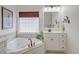 Elegant bathroom showcasing a soaking tub, and a vanity for a spa-like experience at 1006 Retreat Ave, Moncks Corner, SC 29461