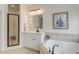 Well-lit bathroom featuring a soaking tub, a walk-in shower, and modern fixtures at 1006 Retreat Ave, Moncks Corner, SC 29461