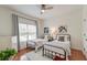 Charming bedroom with twin beds, decorative art, and a large window at 1006 Retreat Ave, Moncks Corner, SC 29461