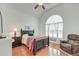 Cozy bedroom features a vaulted ceiling, natural light, and hardwood floors at 1006 Retreat Ave, Moncks Corner, SC 29461