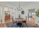 Bright dining room with hardwood floors, a stylish chandelier, and views into other living spaces at 1006 Retreat Ave, Moncks Corner, SC 29461