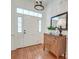 Elegant entryway features a decorative front door, hardwood floors, and classic decor at 1006 Retreat Ave, Moncks Corner, SC 29461