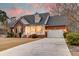 Brick home with a two-car garage and cozy front porch at 1006 Retreat Ave, Moncks Corner, SC 29461