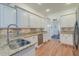 Modern kitchen with granite countertops, stainless steel appliances, and white cabinetry at 1006 Retreat Ave, Moncks Corner, SC 29461