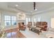 Spacious living room features hardwood floors, a fireplace, and plenty of natural light at 1006 Retreat Ave, Moncks Corner, SC 29461