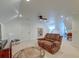 Large living room features a brown leather love seat and overhead lighting at 1006 Retreat Ave, Moncks Corner, SC 29461