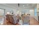Bright living room featuring hardwood floors, neutral furniture, and a tray ceiling with recessed lighting at 1006 Retreat Ave, Moncks Corner, SC 29461