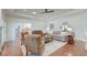 Spacious living room with hardwood floors, comfortable seating, and seamless flow to other living areas at 1006 Retreat Ave, Moncks Corner, SC 29461