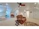 Spacious living room with a loveseat, comfortable seating, and a ceiling fan at 1006 Retreat Ave, Moncks Corner, SC 29461