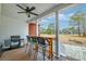 Covered porch featuring bar seating and a grill, offering a relaxing outdoor space with views of the yard at 1006 Retreat Ave, Moncks Corner, SC 29461