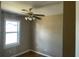 Cozy bedroom with a ceiling fan, natural light, and hardwood floors at 105 Dalton Ave, North Charleston, SC 29420