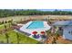Aerial view of a pool with lounge chairs, tables and umbrellas at 107 Crosscut Ln, Summerville, SC 29486