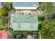 Birds eye view of home showing backyard seating area, courtyard, and pristine green roof at 111 S Battery St, Charleston, SC 29401