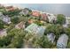 Scenic aerial view featuring a home and neighborhood with views of the waterfront in the distance at 111 S Battery St, Charleston, SC 29401