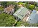 Aerial view of a home with a green tile roof and private courtyard with outdoor seating at 111 S Battery St, Charleston, SC 29401