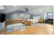 Spacious bedroom with vaulted ceiling, sitting area, large windows, and light hardwood floors at 111 S Battery St, Charleston, SC 29401