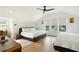 Spacious bedroom featuring two queen beds, hardwood floors, and large windows at 111 S Battery St, Charleston, SC 29401