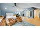 Large bedroom with vaulted ceiling, a sitting area, and light hardwood floors at 111 S Battery St, Charleston, SC 29401