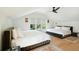 Spacious bedroom featuring two queen beds, hardwood floors, and large windows at 111 S Battery St, Charleston, SC 29401