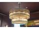 Close up shot of an elegant and dazzling multi tiered chandelier in a dining room at 111 S Battery St, Charleston, SC 29401
