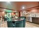 This dining area features a dining table, bar, and adjoins a cozy lounge, ideal for entertaining at 111 S Battery St, Charleston, SC 29401