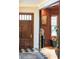 Elegant entryway featuring a dark wood door, black and white tiled floor, and decorative accents at 111 S Battery St, Charleston, SC 29401