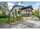 A home featuring manicured lawns, brick pavers, and an inviting side porch area at 111 S Battery St, Charleston, SC 29401