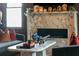 Close-up of fireplace and coffee table with decorative decor and details at 111 S Battery St, Charleston, SC 29401