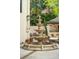 Tiered fountain centerpiece, features a travertine base, surrounded by brick-accented travertine paving at 111 S Battery St, Charleston, SC 29401