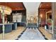 Grand foyer with marble accents, elegant staircase, and herringbone wood flooring at 111 S Battery St, Charleston, SC 29401